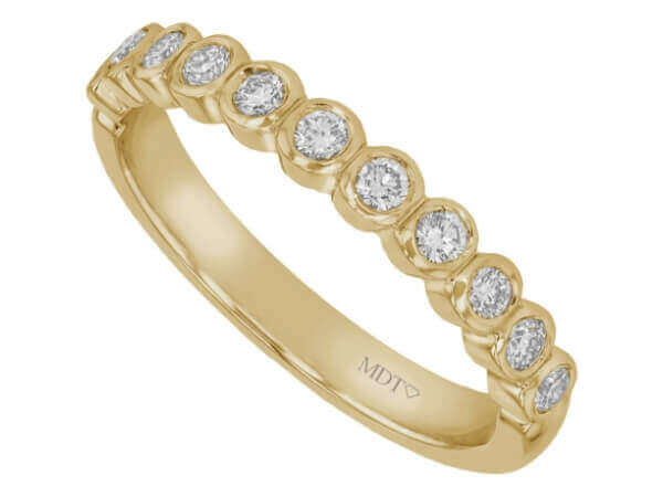 18ct yellow gold wedding band adorned with bezel-set round diamonds.