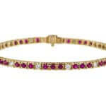 A Claw Set Ruby and Diamond Tennis Bracelet C926 elegantly crafted in yellow gold. Each stunning gem is securely claw-set, creating a brilliant display of beauty and sophistication.