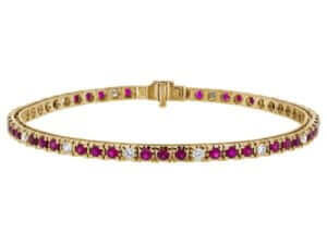 A Claw Set Ruby and Diamond Tennis Bracelet C926 elegantly crafted in yellow gold. Each stunning gem is securely claw-set, creating a brilliant display of beauty and sophistication.