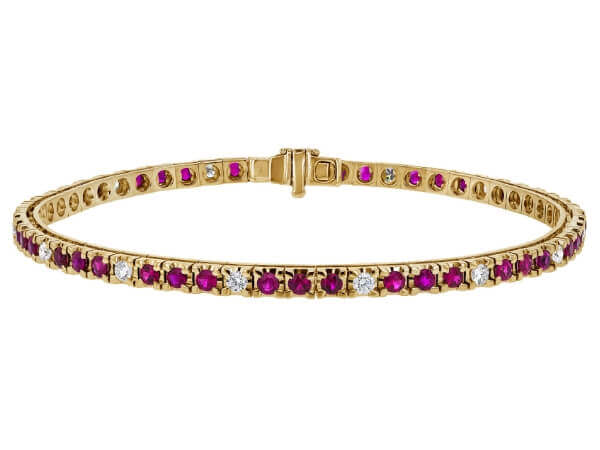 A Claw Set Ruby and Diamond Tennis Bracelet C926 elegantly crafted in yellow gold. Each stunning gem is securely claw-set, creating a brilliant display of beauty and sophistication.
