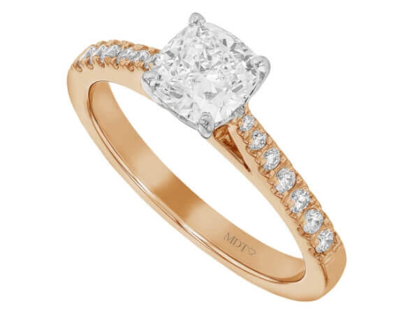 A 1.00ct cushion cut diamond engagement ring in rose gold featuring a diamond band.