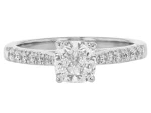 This stunning white gold engagement ring features a mesmerizing cushion cut diamond.