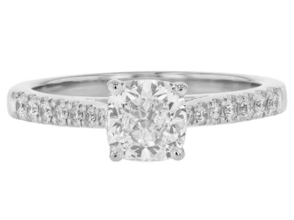 This stunning white gold engagement ring features a mesmerizing cushion cut diamond.