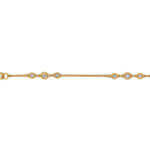 A bezel set yellow gold bracelet with .05ct and .025ct diamonds.