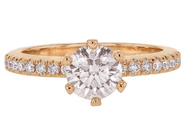 A diamond engagement ring with an oval cut and hidden halo in 14k yellow gold.