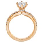 A stunning rose gold engagement ring featuring a diamond set in the center.