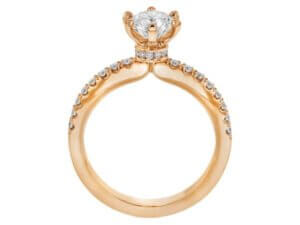 A stunning rose gold engagement ring featuring a diamond set in the center.