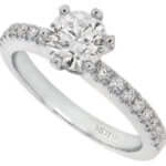 A round diamond engagement ring in white gold with a hidden halo.