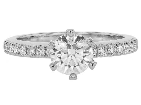 A white gold diamond engagement ring with an oval cut and hidden halo.