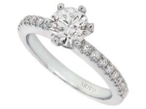 A round diamond engagement ring in white gold with a hidden halo.