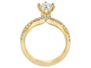 A Diamond Engagement Ring with Diamond Hidden Halo C1055 with a round cut diamond in the center, featuring a hidden halo in yellow gold.