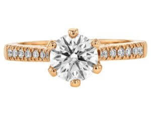 A stunning oval diamond engagement ring in 14k rose gold, featuring a hidden halo setting.
