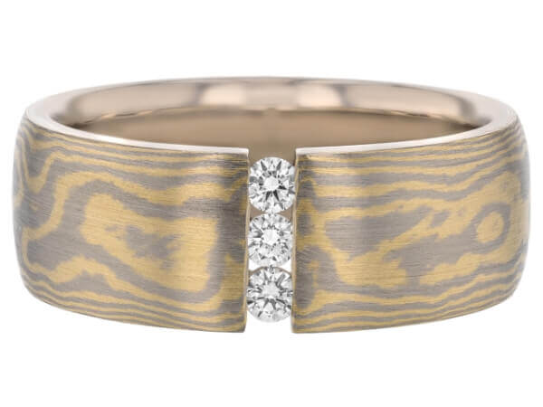 A yellow gold band with two Diamond Set Wide Mokume Gane Ring C722 accents in the center.