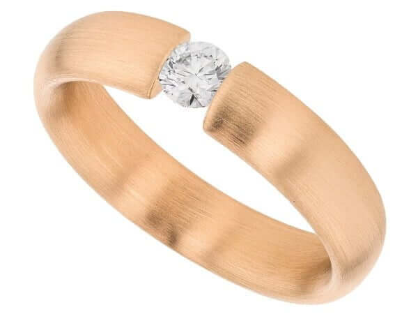 A tension set rose gold ring with a diamond in the center.