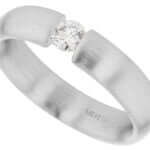 A tension set diamond engagement ring in white gold.