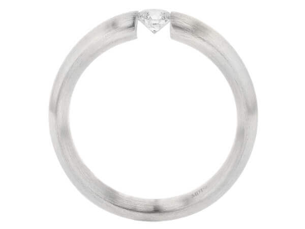 A Tension Set white gold ring with a diamond in the middle.
