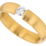 A Diamond Tension Set with Rounded Band and Emery Finish C015 in yellow gold.