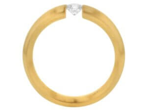 A yellow gold ring with a Diamond Tension Set with Rounded Band and Emery Finish C015 in the center, featuring a rounded band and a diamond tension set.