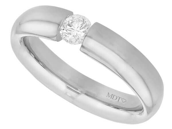 A tension set white gold ring with a round diamond in the center, polished finish