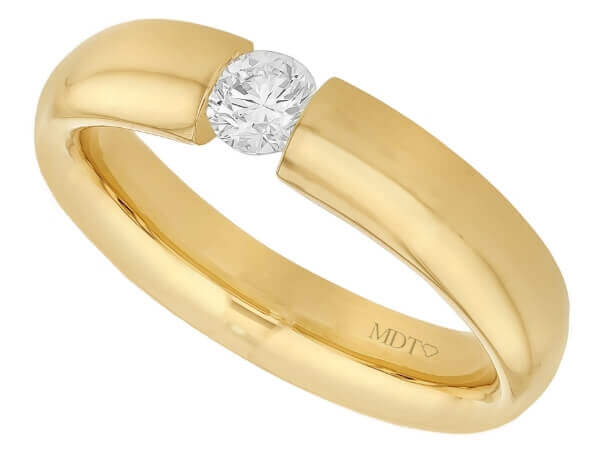 A yellow gold ring with a diamond in the center, beautifully tension set -polished finish