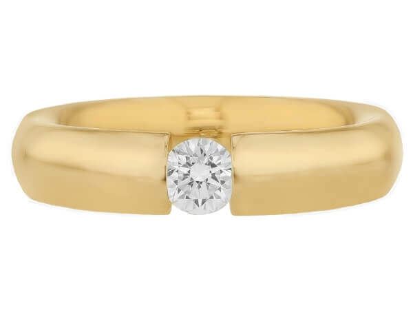 A tension set yellow gold ring with a diamond in the center with polished finish - top view