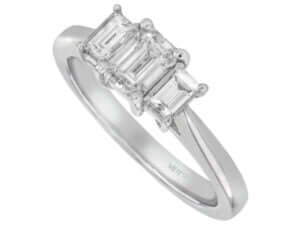 White gold Diamond Trilogy engagement ring with emerald cut diamonds.