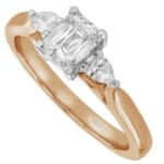 An emerald cut diamond trilogy engagement ring with pear shapes in rose gold c1236