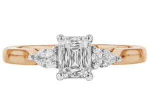 A stunning Emerald Cut Diamond Trilogy Engagement Ring with Pear Shapes C1236 with a rose gold band -top view