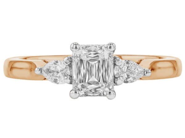 A stunning Emerald Cut Diamond Trilogy Engagement Ring with Pear Shapes C1236 with a rose gold band -top view