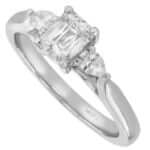 An emerald cut diamond engagement ring trilogy with pear shapes in white gold c1236