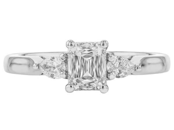 A stunning Emerald Cut Diamond Trilogy Engagement Ring with Pear Shapes C1236 with a white gold band -top view