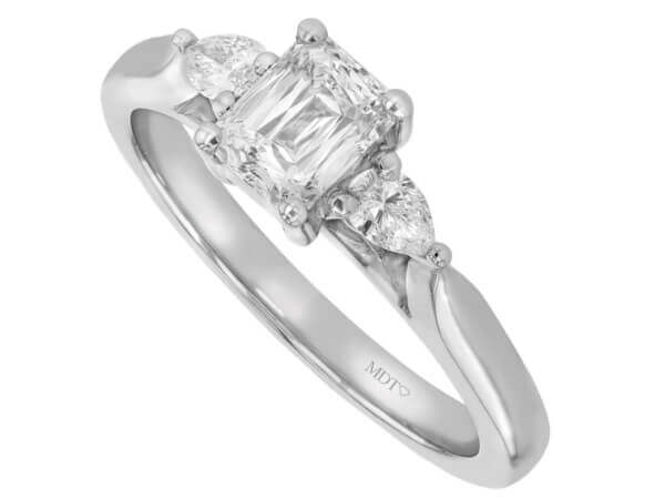 An emerald cut diamond engagement ring trilogy with pear shapes in white gold c1236