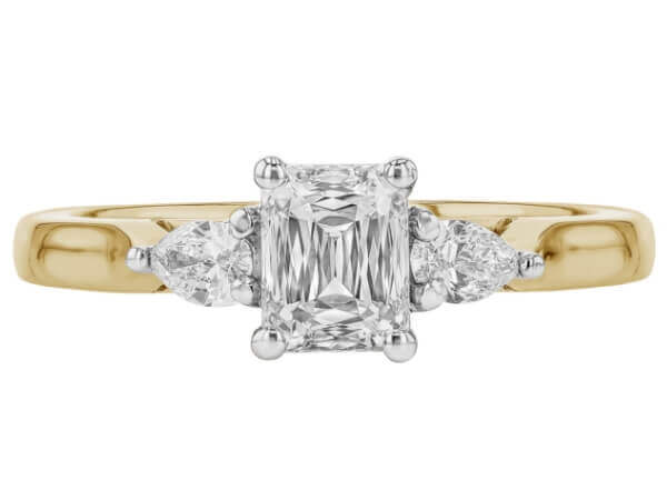 A stunning Emerald Cut Diamond Trilogy Engagement Ring with Pear Shapes C1236 with a yellow gold band -top view