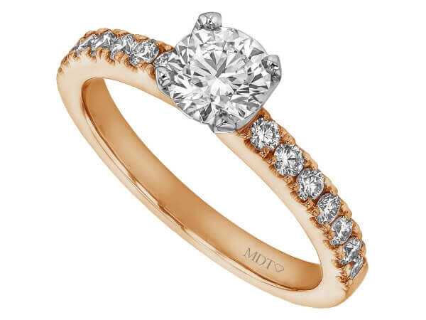 A rose gold engagement ring featuring a stunning four claw set diamond and claw set small diamonds in the band