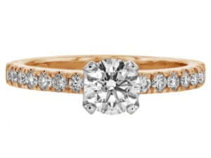 An oval diamond engagement ring set in rose gold. This stunning piece features a diamond band and exquisite craftsmanship, making it the perfect choice for those seeking a luxurious rose gold diamond engagement ring.