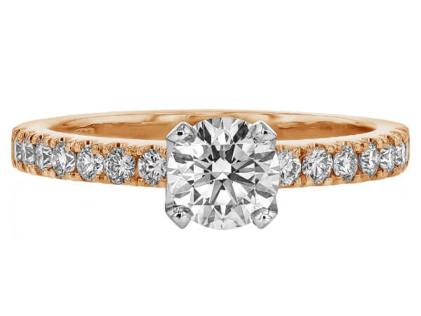 An oval diamond engagement ring set in rose gold. This stunning piece features a diamond band and exquisite craftsmanship, making it the perfect choice for those seeking a luxurious rose gold diamond engagement ring.