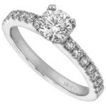An elegant engagement ring featuring a round diamond set on a white gold band.