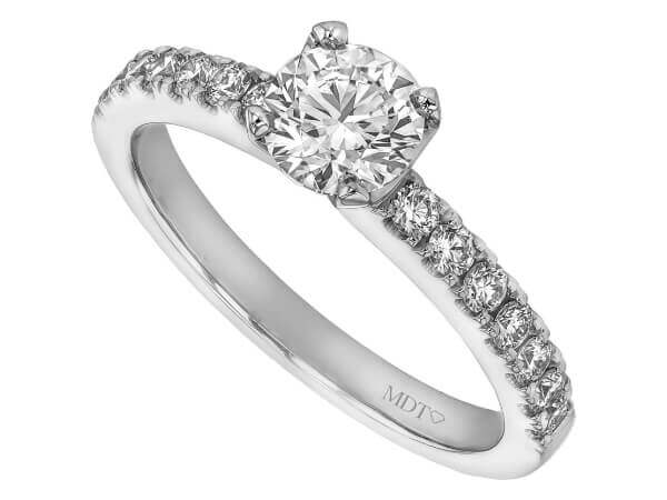 An elegant engagement ring featuring a round diamond set on a white gold band.