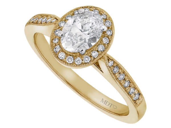 A stunning Grain Set Oval Diamond Halo Engagement Ring C1018, delicately crafted in yellow gold.