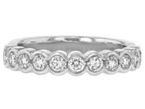 This white gold band features round diamonds in a half bezel-set design, making it a stunning and elegant round diamond wedding ring.