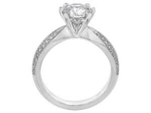 An exquisite engagement ring with a dazzling diamond on a pristine white background.