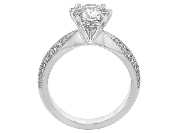 An exquisite engagement ring with a dazzling diamond on a pristine white background.