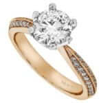 A round diamond engagement ring in rose gold with a hidden halo.