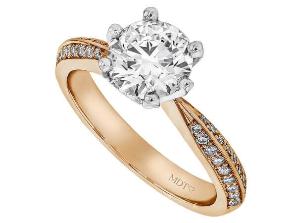 A round diamond engagement ring in rose gold with a hidden halo.
