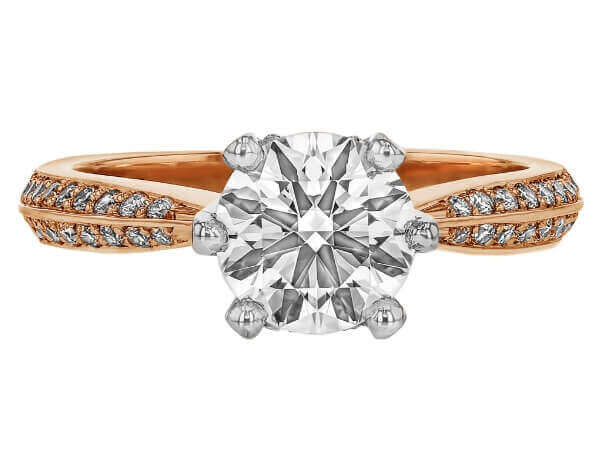 A stunning oval cut diamond engagement ring in rose gold, featuring a hidden halo for added elegance.
