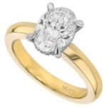 A stunning oval cut diamond engagement ring elegantly crafted in yellow gold.
