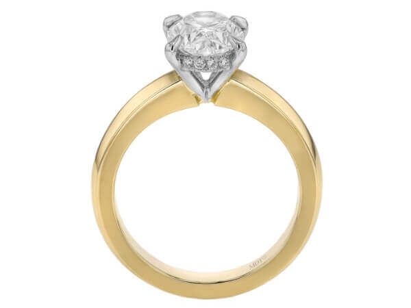 A yellow gold engagement ring showcasing an oval diamond.