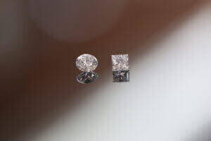 Round and princess cut diamonds close-up.