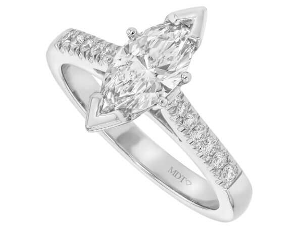 Stunning marquise diamond engagement ring featuring side diamonds, set in elegant white gold.