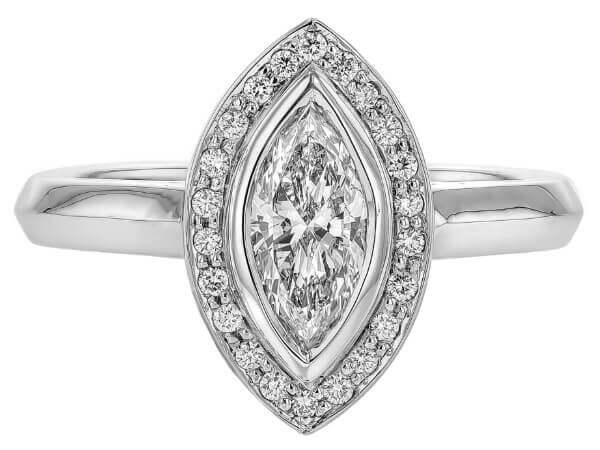 Marquise diamond halo engagement ring in 14k white gold. This stunning ring showcases a captivating marquise diamond held by a delicate halo setting, all crafted in luxurious 14k white gold